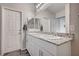 Double vanity bathroom with granite countertop and gray flooring at 4710 Frasers Owl Ave # 103, North Las Vegas, NV 89084