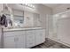 Double vanity bathroom with granite countertop, large shower, and gray flooring at 4710 Frasers Owl Ave # 103, North Las Vegas, NV 89084