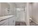 Bathroom with shower, granite countertop, and gray flooring at 4710 Frasers Owl Ave # 103, North Las Vegas, NV 89084