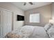 Comfortable bedroom with TV, window blinds, and ceiling fan at 4710 Frasers Owl Ave # 103, North Las Vegas, NV 89084