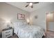 Spacious bedroom with a queen-size bed and lots of natural light at 4710 Frasers Owl Ave # 103, North Las Vegas, NV 89084