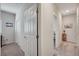 Bright hallway with access to bedrooms and other rooms at 4710 Frasers Owl Ave # 103, North Las Vegas, NV 89084