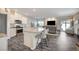 Open concept kitchen with island and stainless steel appliances at 4710 Frasers Owl Ave # 103, North Las Vegas, NV 89084