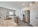 Modern kitchen with stainless steel appliances and granite countertops at 4710 Frasers Owl Ave # 103, North Las Vegas, NV 89084