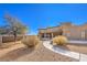 Landscaped backyard with walkway and shrubs at 4780 Mack Ct, Pahrump, NV 89060