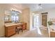 Bathroom features a vanity with seating and large mirror at 4780 Mack Ct, Pahrump, NV 89060