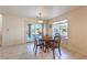 Bright dining area with wooden table, chairs, and sliding glass doors at 4780 Mack Ct, Pahrump, NV 89060