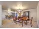 Elegant dining room with a large table, chandelier, and mirrored wall at 4780 Mack Ct, Pahrump, NV 89060