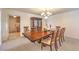 Formal dining room featuring a wood table and chairs, and access to kitchen at 4780 Mack Ct, Pahrump, NV 89060