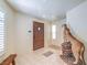 Entryway with tile flooring, wooden door, and mounted animal display at 4780 Mack Ct, Pahrump, NV 89060