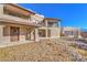 Two-story home with stucco exterior, balcony, and desert landscaping at 4780 Mack Ct, Pahrump, NV 89060