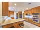 Spacious kitchen featuring oak cabinets, stainless steel appliances, and ample counter space at 4780 Mack Ct, Pahrump, NV 89060