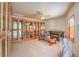 Sitting room with glass-front bookcases and a leather sofa at 4780 Mack Ct, Pahrump, NV 89060