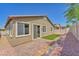 Cozy backyard patio featuring a small patch of artificial turf at 5640 Akula Bay St, North Las Vegas, NV 89081