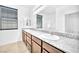 Bathroom with double sinks, granite countertops and a shower over tub at 5640 Akula Bay St, North Las Vegas, NV 89081