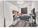 Bedroom features a window, dark wood-look flooring, and a ceiling light at 5640 Akula Bay St, North Las Vegas, NV 89081