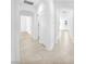 Hallway showcasing neutral tile flooring and bright white walls at 5640 Akula Bay St, North Las Vegas, NV 89081