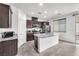 Modern kitchen with stainless steel appliances, granite counters and a center island at 5640 Akula Bay St, North Las Vegas, NV 89081