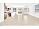 Bright living space showcasing neutral tile flooring, natural light and backyard access at 5640 Akula Bay St, North Las Vegas, NV 89081