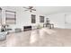 Bright living room with tile flooring and abundant natural light from multiple windows at 5640 Akula Bay St, North Las Vegas, NV 89081