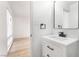 Small bathroom with white vanity and mirror at 6005 W Washington Ave, Las Vegas, NV 89107