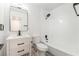 Modern bathroom with white vanity, bathtub, and black fixtures at 6005 W Washington Ave, Las Vegas, NV 89107