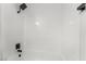 Clean white tiled bathtub and shower at 6005 W Washington Ave, Las Vegas, NV 89107