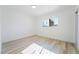 Bright bedroom with light wood floors and window at 6005 W Washington Ave, Las Vegas, NV 89107