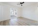 Bedroom with ceiling fan, wood floors and window at 6005 W Washington Ave, Las Vegas, NV 89107