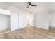 Bright bedroom with wood floors and mirrored closet at 6005 W Washington Ave, Las Vegas, NV 89107