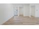 Bright and airy entryway with light wood laminate flooring at 6005 W Washington Ave, Las Vegas, NV 89107