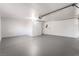 Spacious garage with gray floor and automatic door at 6005 W Washington Ave, Las Vegas, NV 89107