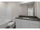 Bathroom with a bathtub, toilet, and modern vanity with dark countertop at 6240 Blood Lily Ave, Las Vegas, NV 89122