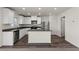 Modern kitchen featuring white cabinets, stainless steel appliances, and a kitchen island at 6240 Blood Lily Ave, Las Vegas, NV 89122