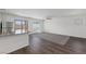 Spacious living room with wood-look floors and a neutral color palette at 6270 Blood Lily Ave, Las Vegas, NV 89122