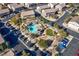 Aerial view of community pool, green areas, and residential buildings at 6529 Za Zu Pitts Ave # 102, Las Vegas, NV 89122