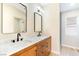 Bathroom with double vanity, marble countertop, and modern fixtures at 6529 Za Zu Pitts Ave # 102, Las Vegas, NV 89122