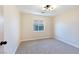 Bright bedroom with a window and neutral carpeting at 6529 Za Zu Pitts Ave # 102, Las Vegas, NV 89122