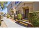 Front entrance of townhouse with walkway and landscaping at 6529 Za Zu Pitts Ave # 102, Las Vegas, NV 89122