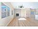 Living room with fireplace and sliding glass door at 6529 Za Zu Pitts Ave # 102, Las Vegas, NV 89122