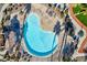 Aerial view of kidney-shaped community pool and deck at 6529 Za Zu Pitts Ave # 102, Las Vegas, NV 89122