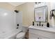 Clean bathroom with a shower/tub combo and vanity at 6628 Silver Penny Ave, Las Vegas, NV 89108