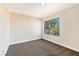 Well-lit bedroom with a large window and carpeted floor at 6628 Silver Penny Ave, Las Vegas, NV 89108