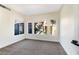 Bright bedroom with carpet flooring and multiple windows at 6628 Silver Penny Ave, Las Vegas, NV 89108