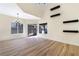 Bright dining room with hardwood floors and sliding glass doors at 6628 Silver Penny Ave, Las Vegas, NV 89108