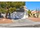 Two-story house with a gray facade and a two-car garage at 6628 Silver Penny Ave, Las Vegas, NV 89108