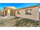 Tan home exterior with a grassy backyard at 6733 Violet Bluff Ct, North Las Vegas, NV 89084