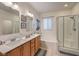 Bright bathroom features dual sinks, bathtub, and separate shower for a relaxing and functional space at 6733 Violet Bluff Ct, North Las Vegas, NV 89084