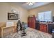 Home office or gym with built-in shelving and a ceiling fan at 6733 Violet Bluff Ct, North Las Vegas, NV 89084