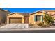 Lovely single-story home featuring a garage, landscaped front yard, and solar panels for energy efficiency at 6733 Violet Bluff Ct, North Las Vegas, NV 89084